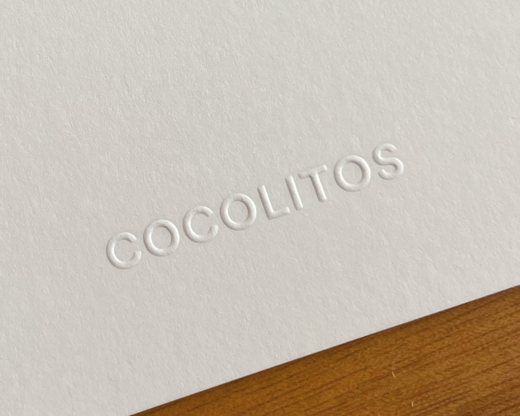 Golpe seco del póster que muestra la marca "Cocolitos"
