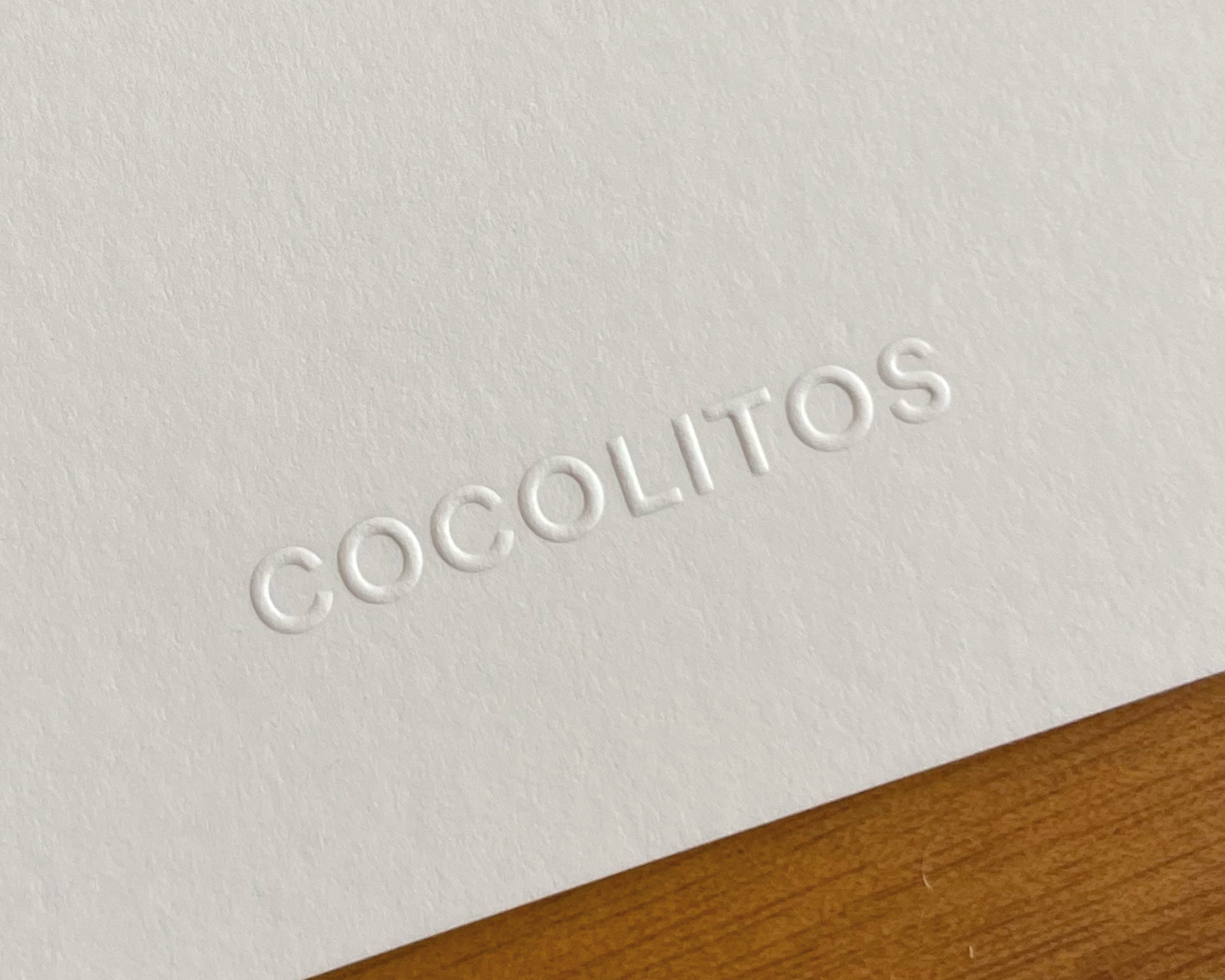 Golpe seco del póster que muestra la marca "Cocolitos"